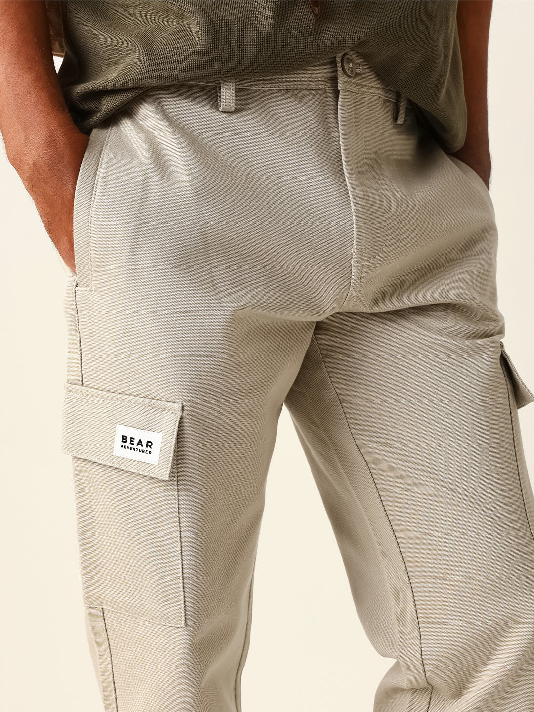 beige solid straight fit cargo trousers with flap pockets beige solid straight fit cargo trousers with flap pockets