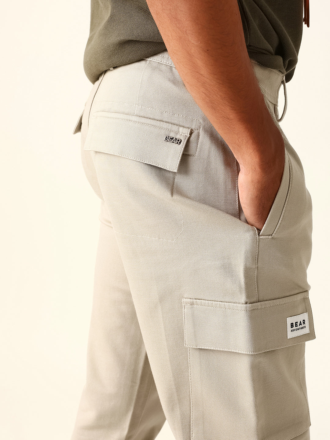 beige solid straight fit cargo trousers with flap pockets beige solid straight fit cargo trousers with flap pockets