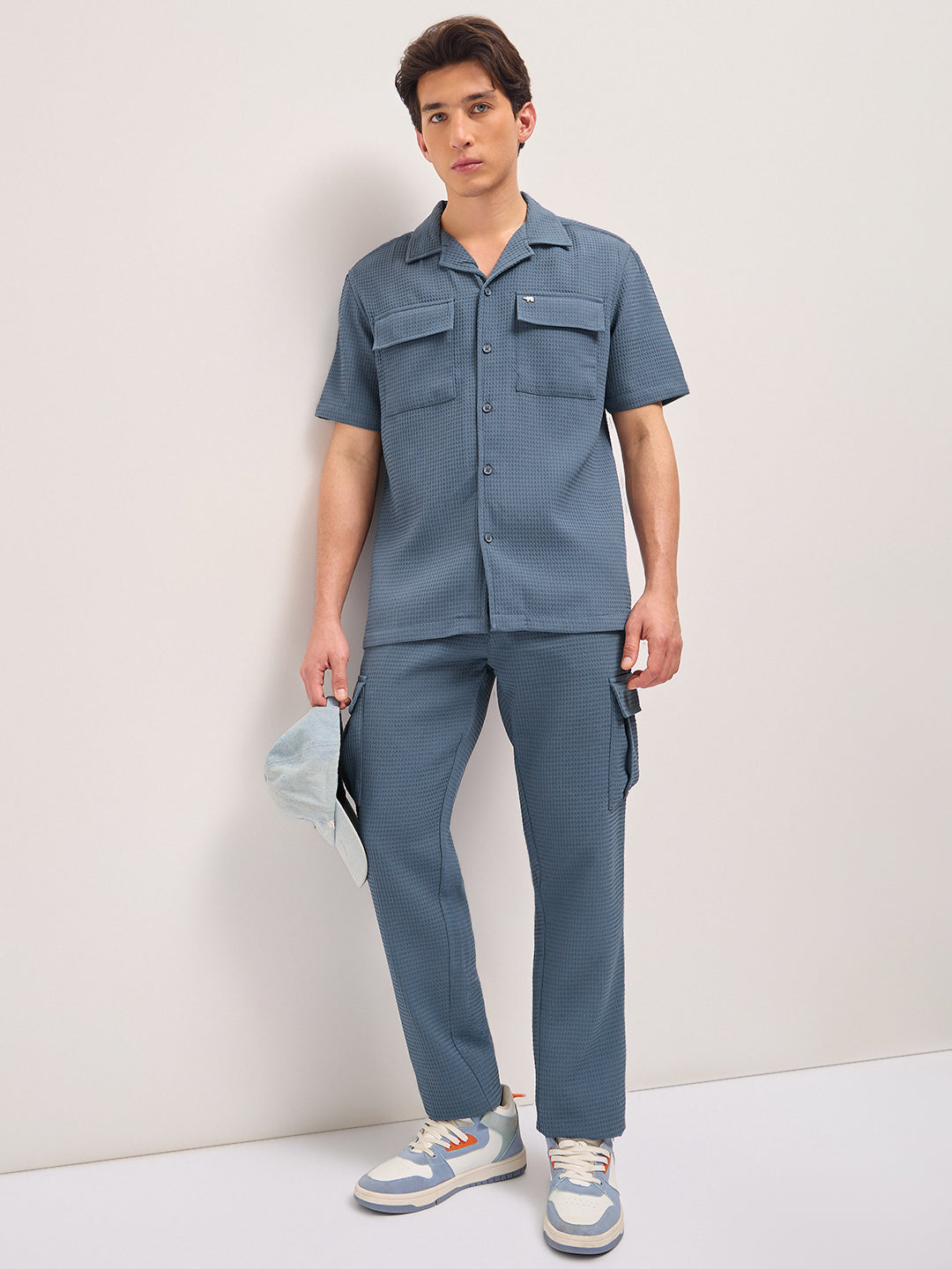 blue textured waffle weave straight fit cargo pants with flap pockets blue textured waffle weave straight fit cargo pants with flap pockets