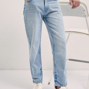 light blue straight fit mid rise jean with splatter paint effect