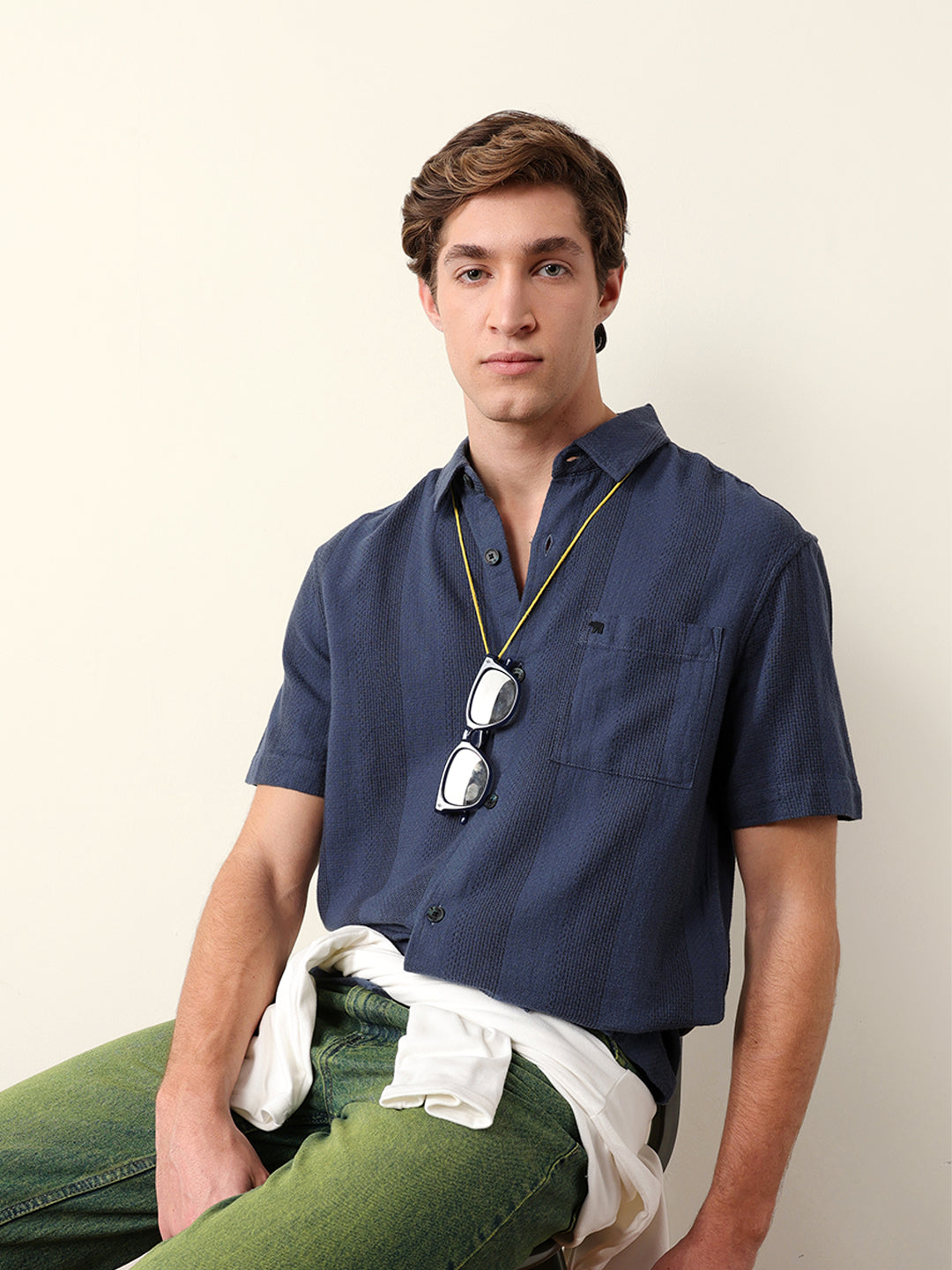 blue relaxed fit casual half sleeve shirt with textured vertical stripes blue relaxed fit casual half sleeve shirt with textured vertical stripes
