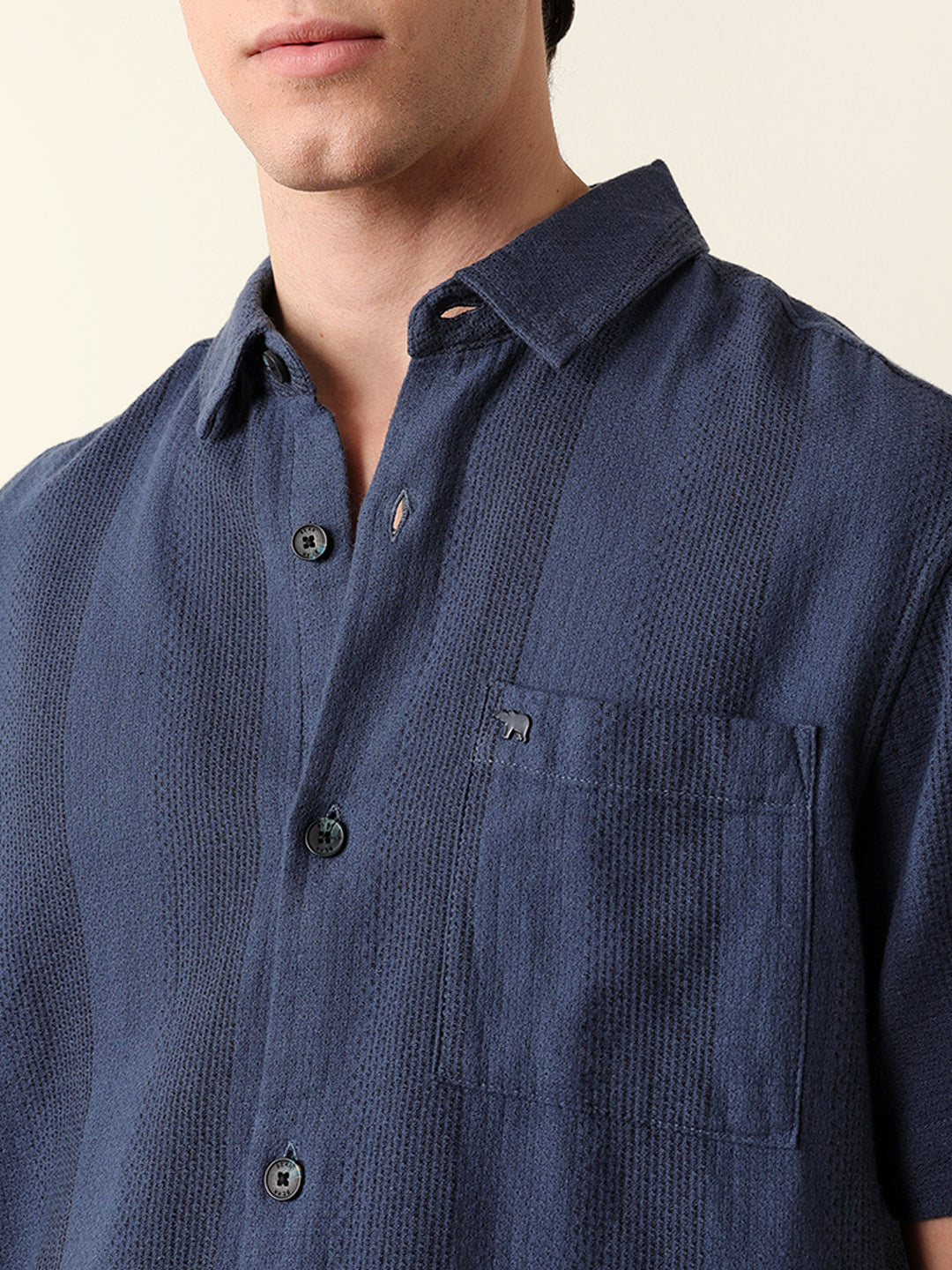blue relaxed fit casual half sleeve shirt with textured vertical stripes blue relaxed fit casual half sleeve shirt with textured vertical stripes
