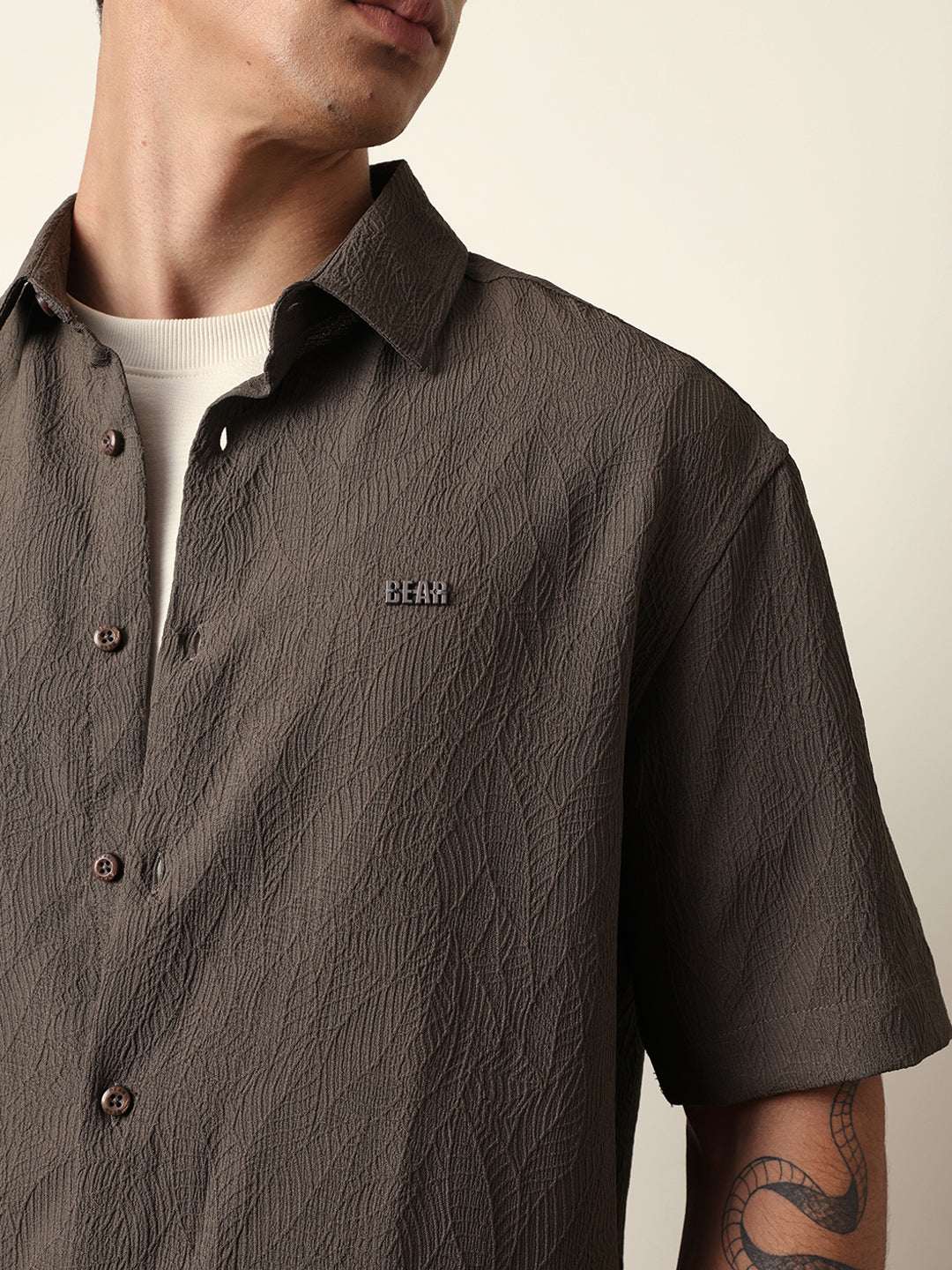 olive all over textured leaf motif oversized shirt with half sleeves olive all over textured leaf motif oversized shirt with half sleeves